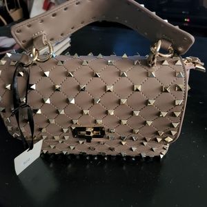 Beautiful bag brand new with tags. Tan color